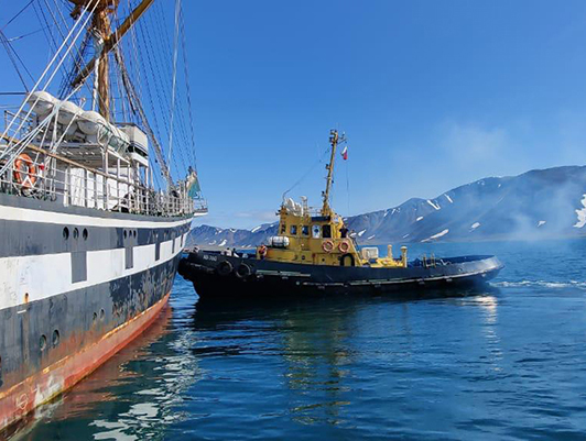 Tugboats of FSUE "Rosmorport" help mooring the sailing boat Pallada in the seaports of Egvekinot and Provideniya